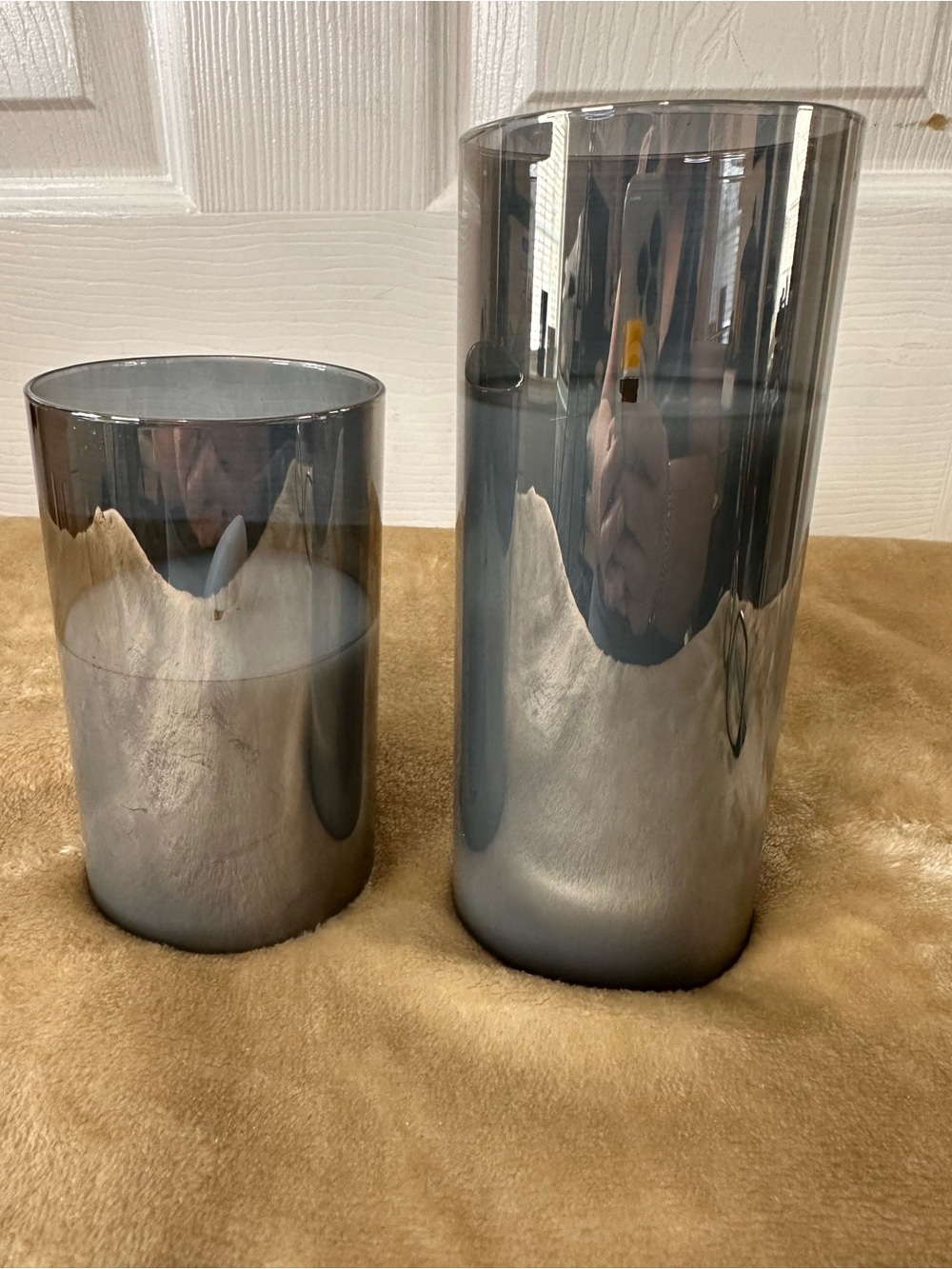 Two flameless candles smoke a greyish-iridescent. Battery operated. Used